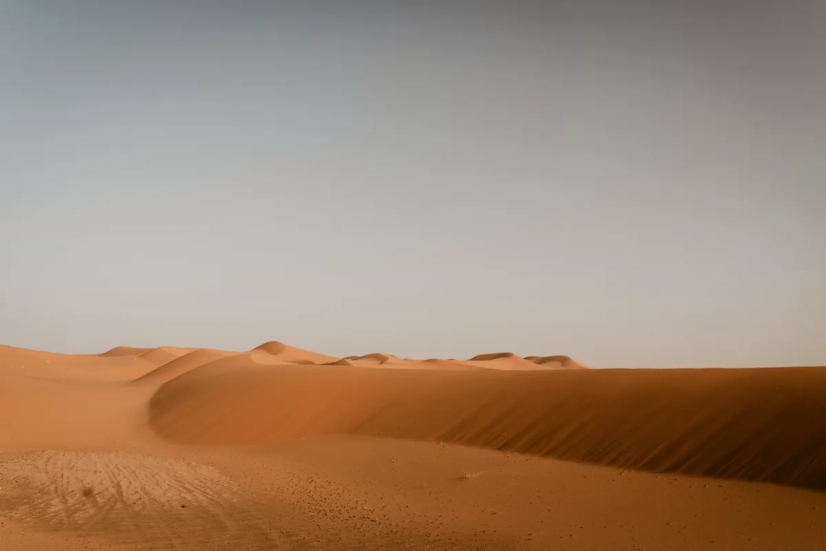Expansive golden sand dunes in Merzouga Erg Chebbi Moroccan Sahara